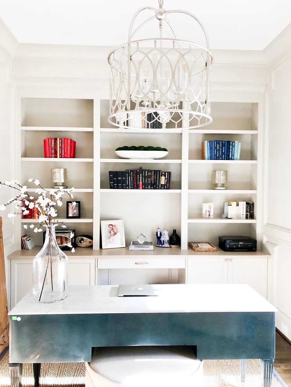 Organized bookshelves by Stript Home Organizing