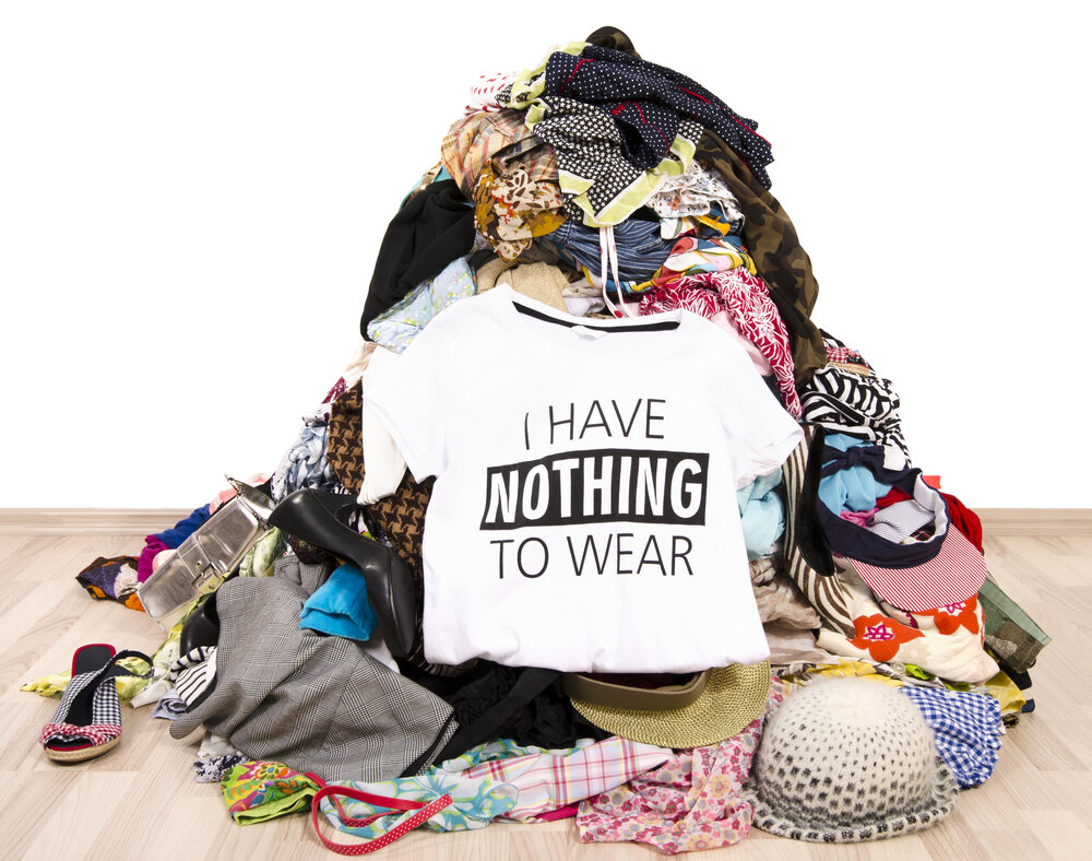 Clothing and accessories gathered for sorting during a decluttering project