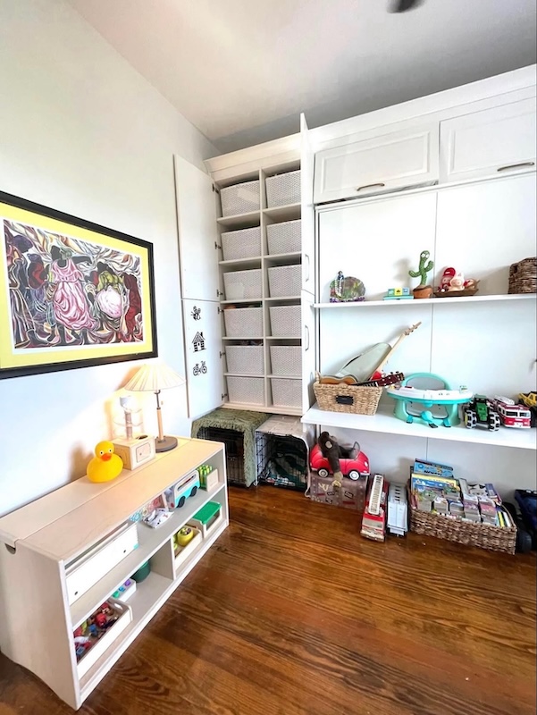 A neat, organized playroom with accessible storage