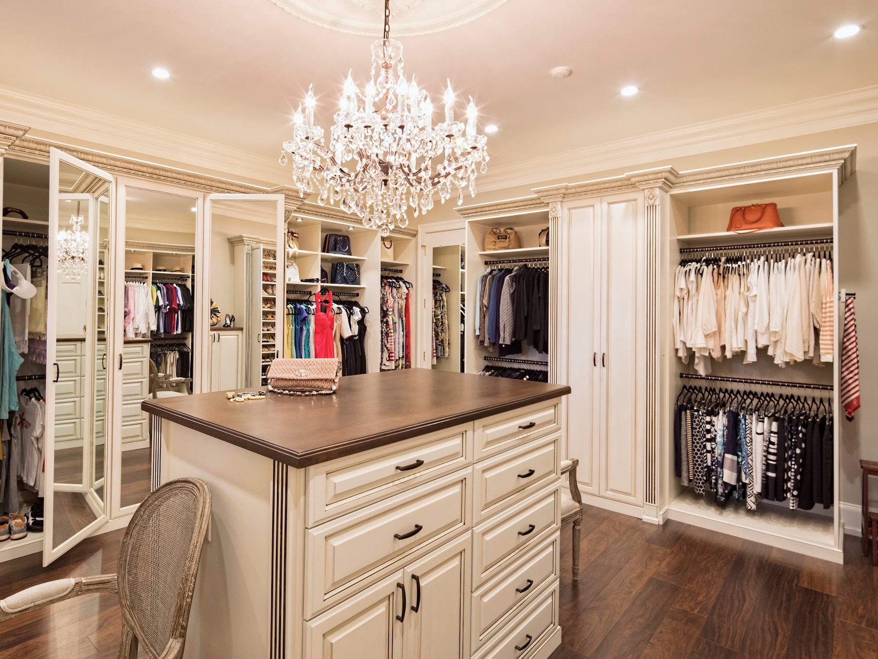 A spacious, organized walk-in closet with clothing storage