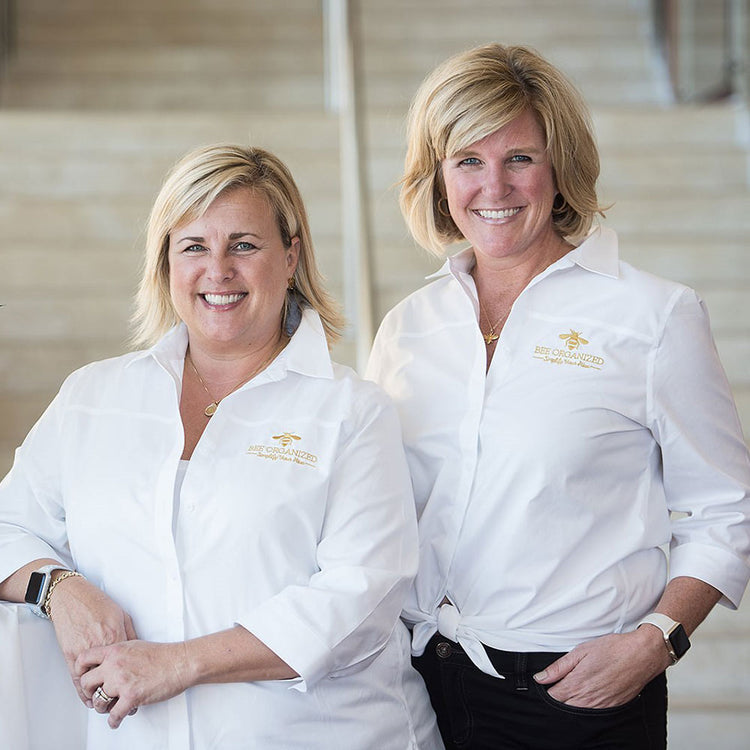 Bee Organized founders in branded white shirts